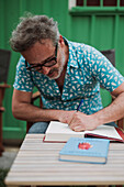 Santi Balmes, Spanish indie-pop musician and writer, front man of the band Love of Lesbian, signing his books in Zaragoza, Spain\n