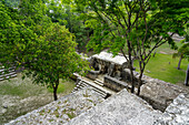Plaza A & Structure A2 viewed from the top of Pyramid A1 in the Mayan ruins in the Cahal Pech Archeological Reserve, Belize.\n