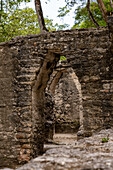 Corbel arch doorways between rooms in Plaza E & Plaza D in the Mayan ruins in the Cahal Pech Archeological Reserve, Belize.\n