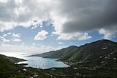 Thick clouds over Coral Bay with sailboats\n