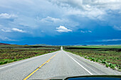 USA, Idaho, Fairfield, Storm clouds gathering above highway\n