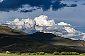 USA, Idaho, Bellevue, Majestic cumulus clouds above mountains\n