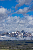 USA, Idaho, Stanley, Fog over forest by Sawtooth Mountains\n