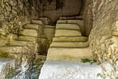 Excavation showing stairs of an earlier pyramid inside Structure A-7 in the Xunantunich Archeological Reserve in Belize.\n