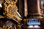 Worshipers kissing the pillar inside the Cathedral-Basilica of Our Lady of the Pillar during The Offering of Flowers to the Virgen del Pilar, the most important and popular event of the Fiestas del Pilar held on Hispanic Day, Zaragoza, Spain\n