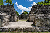 Structure A-13 in Plaza A-2 in the foreground with Structure A-11 behind in the Xunantunich Archeological Reserve in Belize.\n