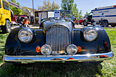 Front view of a 1991 Morgan Plus 8 convertible sports car in a car show in Moab, Utah.\n