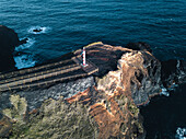 Aerial view of Farolim dos Fenais da Ajuda lighthouse on a cliff, Sao Miguel island, Azores Islands, Portugal, Atlantic, Europe\n
