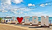 Sign welcoming visitors and holidaymakers on the seafront at Eastbourne, East Sussex, England, United Kingdom, Europe\n