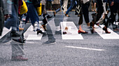 Close up view of Shibuya Crossing with people crossing street in a multi exposure, Tokyo, Honshu, Japan, Asia\n