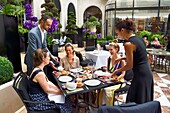 France, Paris, Four Seasons Hotel George V, L'Orangerie restaurant in the courtyard\n