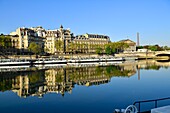 France, Paris, area listed as World Heritage by UNESCO, the banks of the Seine river, the National Assembly (Palais Bourbon) and the Eiffel Tower on the background\n