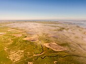 France, Somme, Somme Bay, Saint-Valery-sur-Somme, Cape Hornu and the channel of the Somme in the morning mist (aerial view)\n