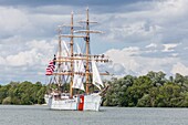 France, Seine Maritime, Mesnil sous Jumieges, Armada 2019, Grande Parade, Eagle, three masted schooner, sailing on the Seine River, among a lush green landscape\n