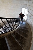 France, Gironde, Verdon-sur-Mer, rocky plateau of Cordouan, lighthouse of Cordouan, classified Historical Monuments, lighthouse keeper playing sports on stairs\n