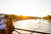 France, Paris, area listed as World Heritage by UNESCO, lovers on the Pont des Arts\n