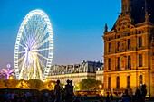 France, Paris, Tuileries garden, the museum of Decorative Arts located the pavilion of Marsan of the Louvre Palace and the Ferris Wheel\n