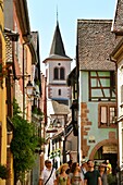 France, Haut Rhin, Alsace Wine Route, Riquewihr, labelled Les Plus Beaux Villages de France (The Most Beautiful Villages of France), traditionals half timbered houses, catholic church\n