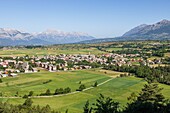 France, Hautes Alpes, Ecrins National Park, Champsaur Valley, Ancelle, the village with Devoluy and the Faraut mountain in background\n