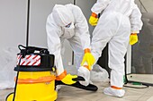 France, Eure, Grand Bourgtheroulde, environmental laboratory, staff decontamination after an incident, practical exercises during a training session on asbestos risk prevention\n