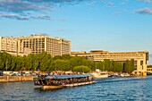 France, Paris, the banks of the Seine, the Ministry of Economy and Finance and a riverboat\n