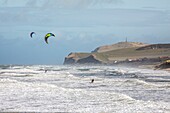 France, Pas de Calais, cote d'Opale, Wissant bay at high tide on a stormy day and big tide, kite surfing (Cap Blanc Nez in background)\n