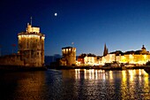 France, Charente Maritime, La Rochelle, the Vieux Port (Old Port) with Saint Nicolas tower and Chain tower on left and Tour de la Lanterne (Lantern tower)\n