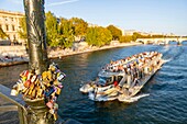 France, Paris, area listed as World Heritage by UNESCO, Padlock of Love on the Pont des Arts, and a fly boat\n
