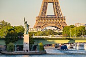 France, Paris, the banks of the Seine, the Swan Island with the Statue of Liberty and the Eiffel Tower\n
