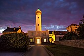 France, Morbihan, wild coast, Quiberon peninsula, Port Maria lighthouse at dusk\n