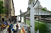 France, Paris, the basin of La Villette, the largest artificial body of water in Paris, that links the Canal de l'Ourcq to the Canal Saint-Martin, the lift bridge of Crimee street\n