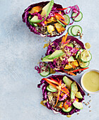 Vegan satay pumpkin bowls with quinoa and red cabbage