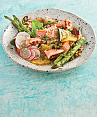 Citrus and salmon salad with green asparagus, radishes and lentils