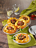 Mini pies with ground meat, peppers and feta cheese
