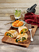 Pepper and spinach tortillas with roasted paprika hummus