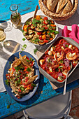 Greek starters - layered dip, orzo salad, tomato and feta dip