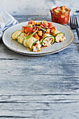 Vegan zucchini cannelloni with vegetable and rice filling