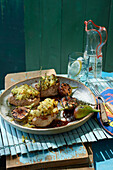 Grilled pork medallions with a potato and thyme crust