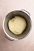 Yeast dough in a metal bowl