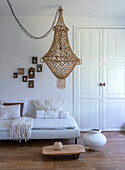 Bright living room with macramé light and white sofa