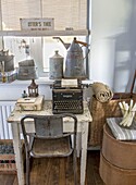 Vintage desk with typewriter and antique decoration