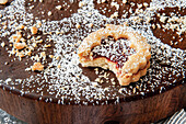 Bitten Linzer cookie with powderd sugar