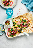 Steak tacos with spring onions and salsa