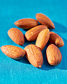 Almonds on a blue background
