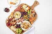 Fruit and nut board with cheese, ham and sausage