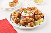 Sausage and cheese balls with chili yogurt dip