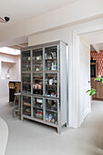 Metal display cabinet, view into the kitchen