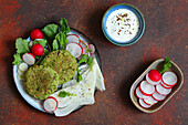Chickpea and pea falafel with radishes and salad