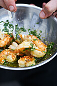 Marinate shelled prawns in oil and herbs