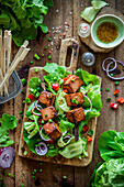 Salad with cucumber, onion and tofu skewers